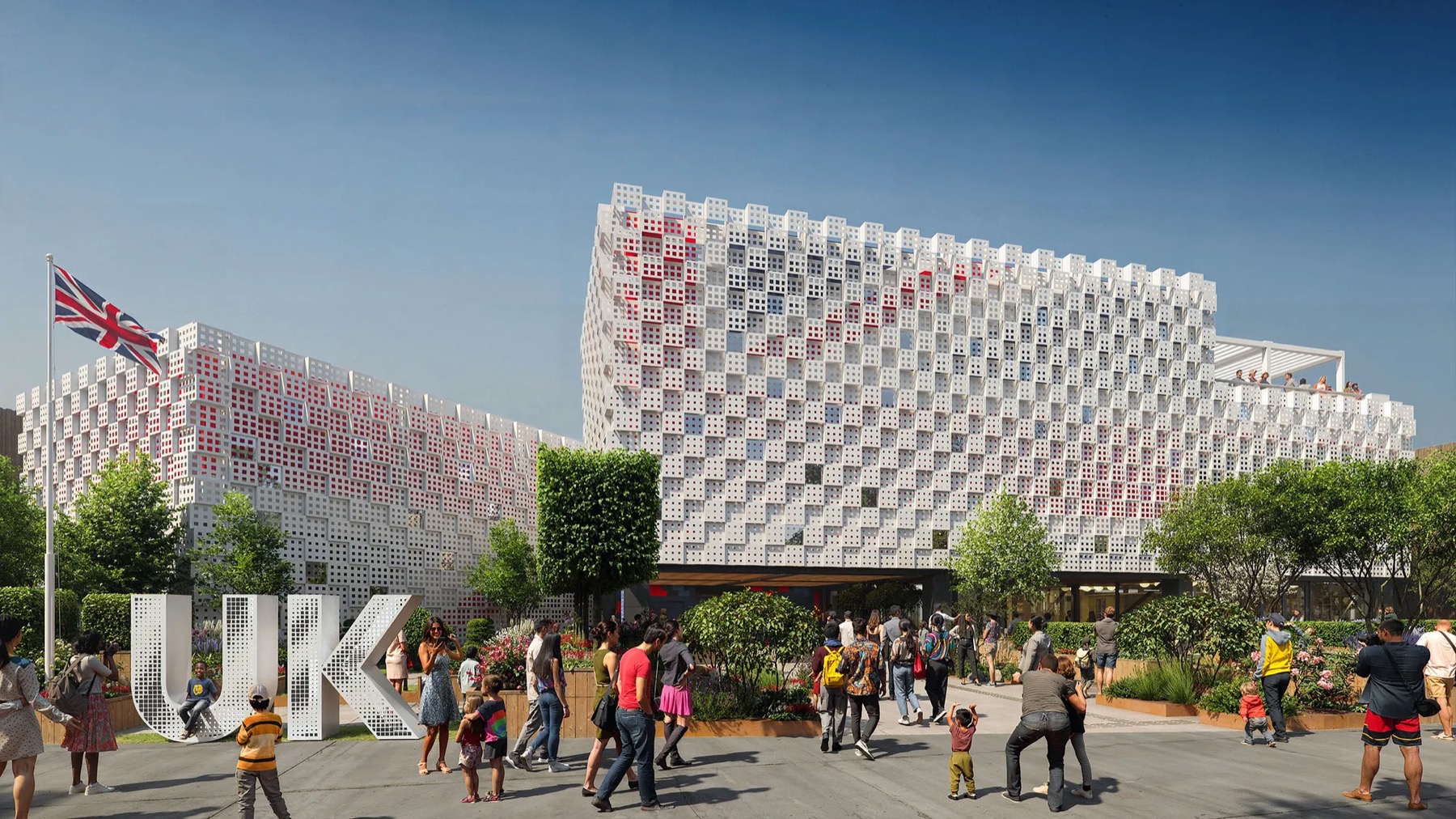 The United Kingdom pavilion at Expo 2025 Osaka, its facade patterned in red, white and blue, with visitors outside